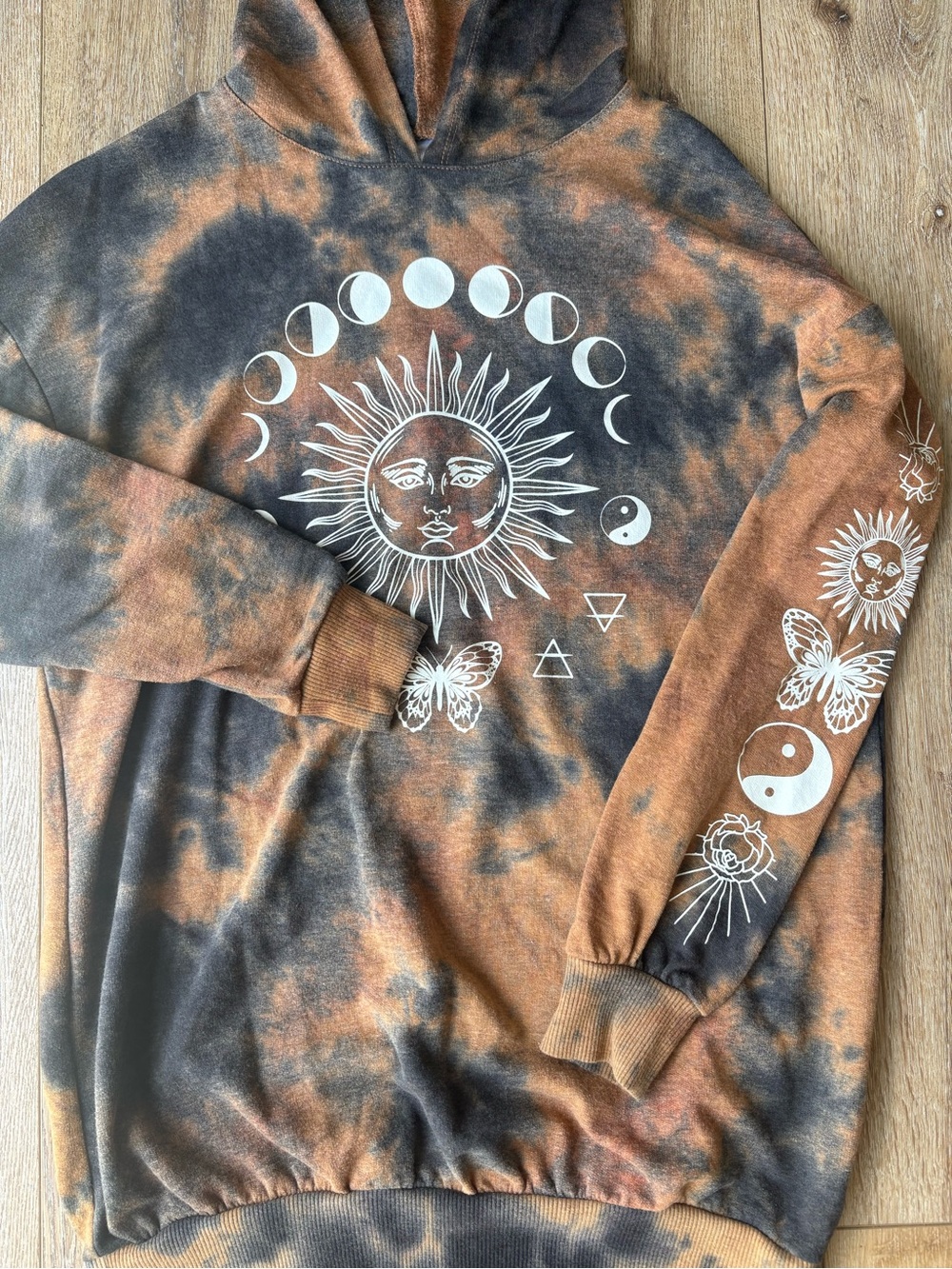 No Boundaries Sun & Moon Tie-Dye Graphic Hoodie in Black and Rust